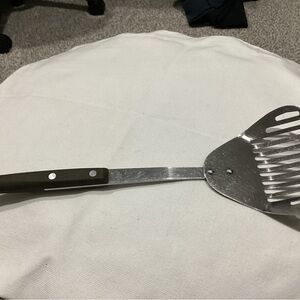Vintage Household Stainless Steel pre-owned cooking utensil.